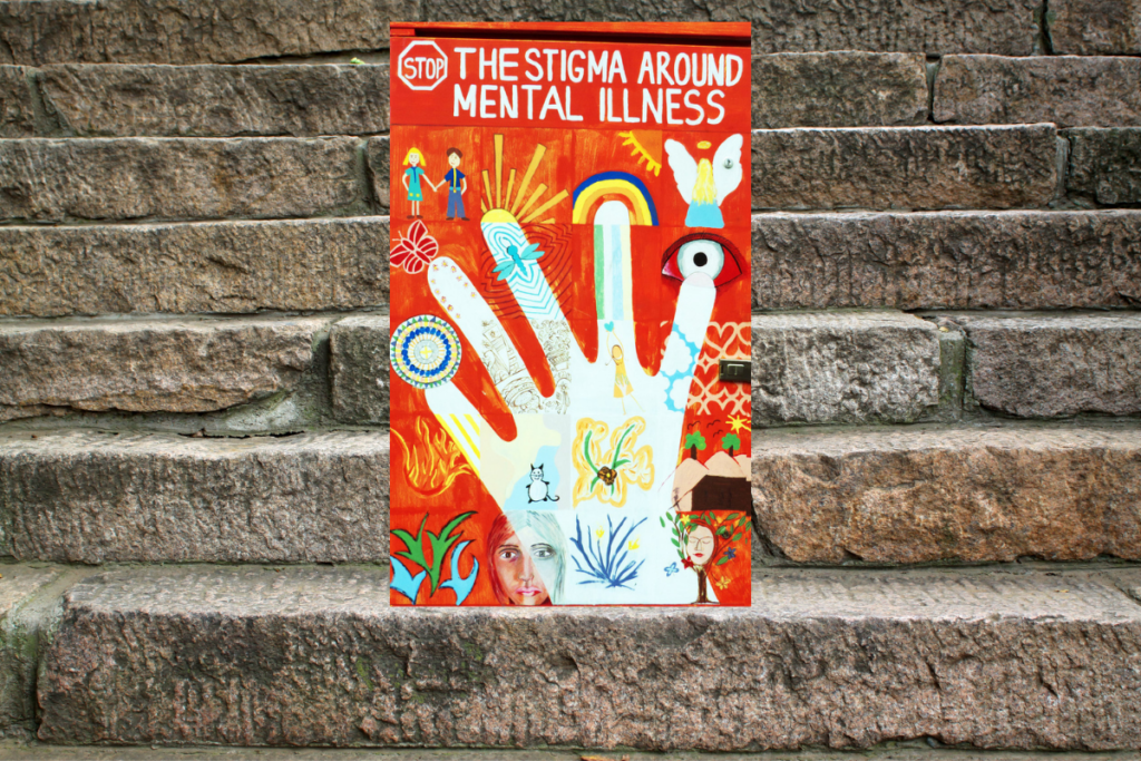 A sign sitting atop stone steps that reads, "Stop the Stigma on Mental Illness"; which was selected to accompany a letter written to PTSD for the Dear Diagnosis literary project.