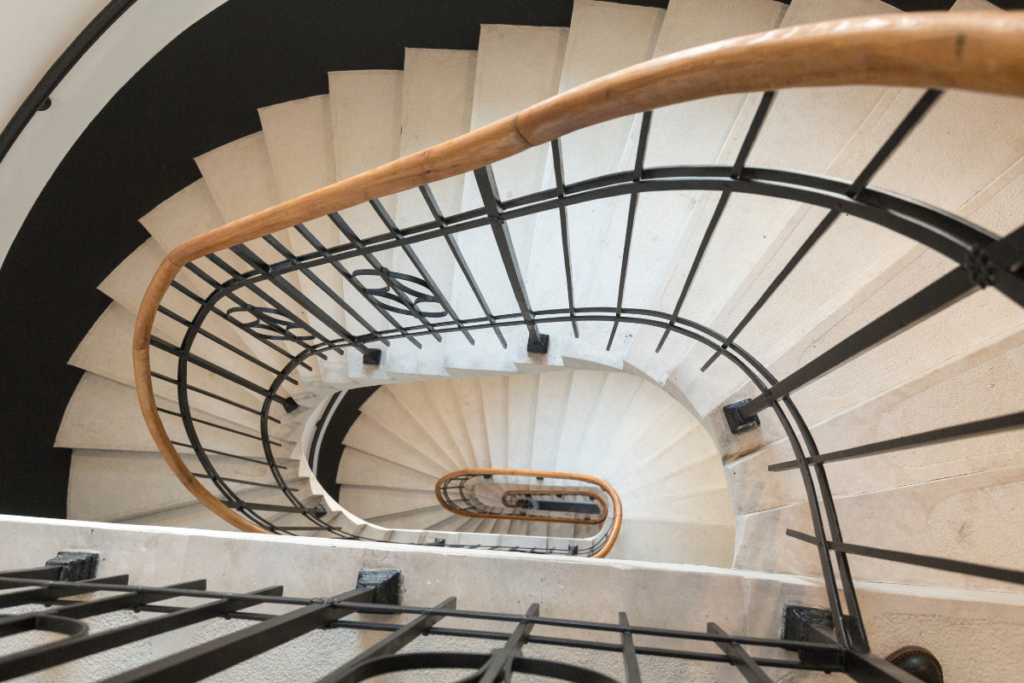 A downward spiraling staircase used to capture the tone of the associated letter written to Depression for Dear Diagnosis